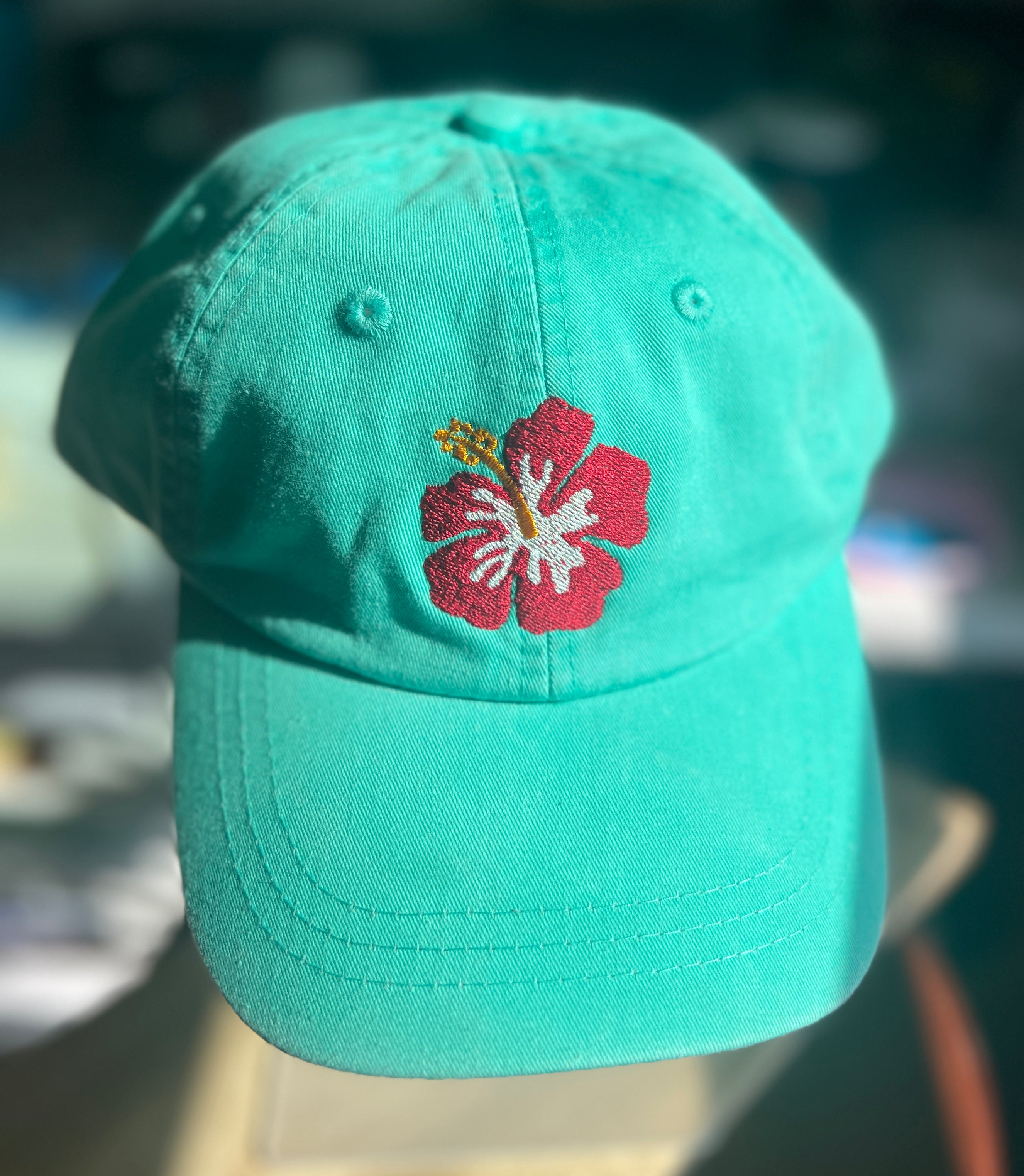 Teal ball cap with hibiscus