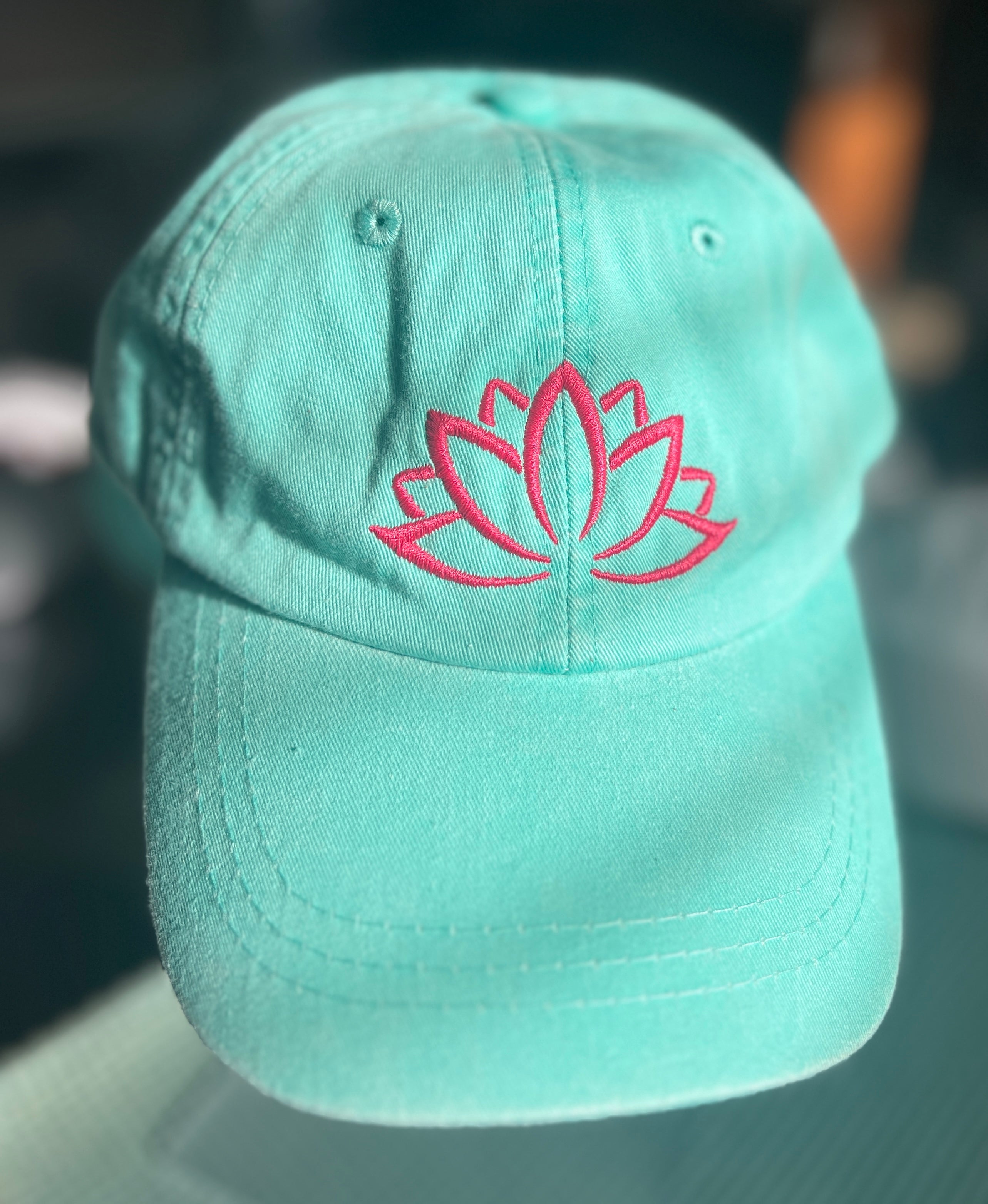 Teal ball cap with lotus