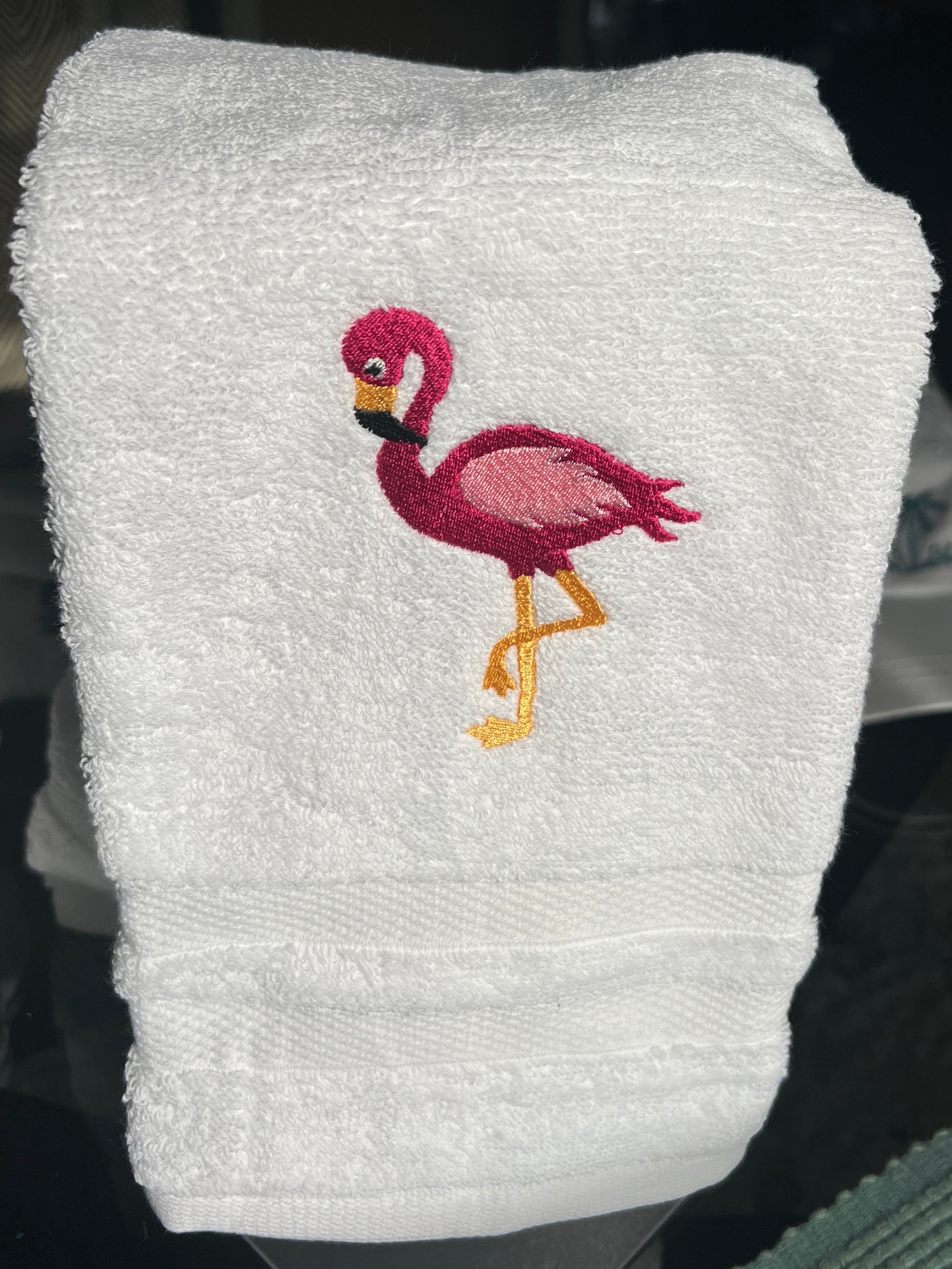 White hand towel with flamingo
