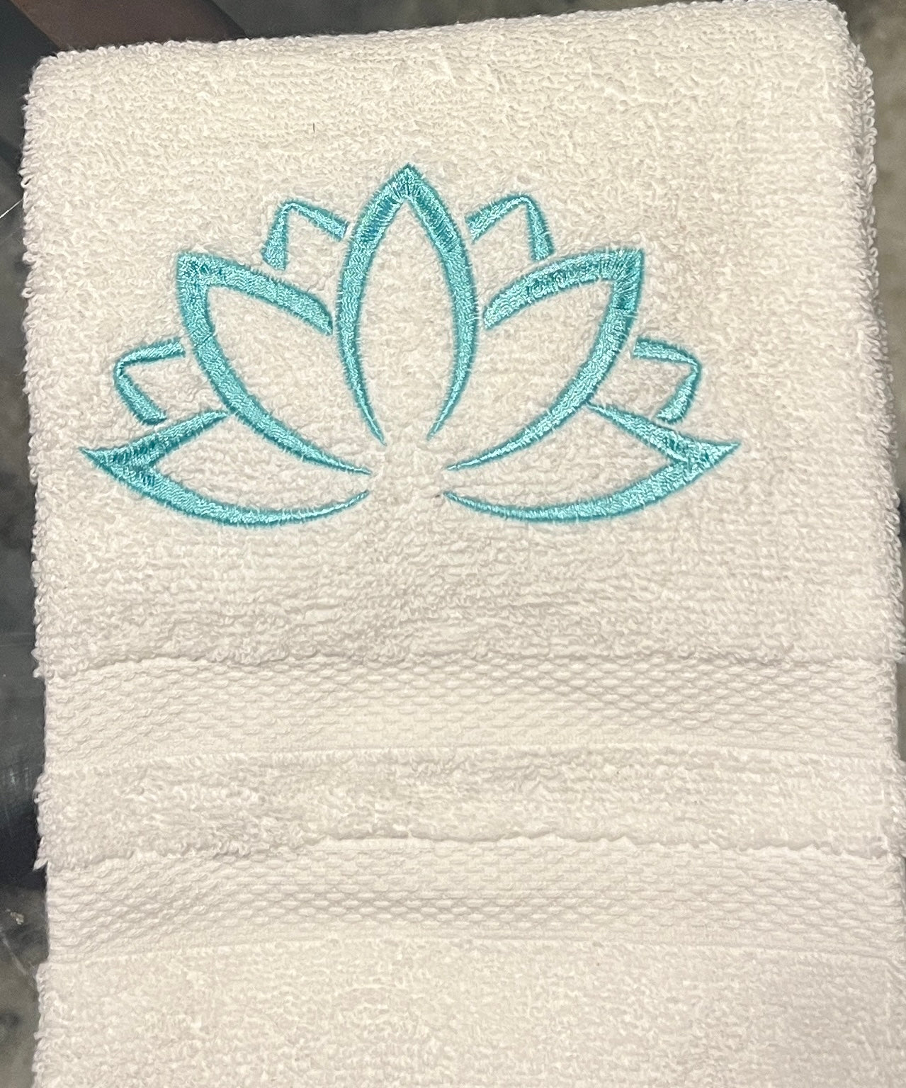 White hand towel with lotus