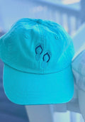 Teal ball cap with flip flops