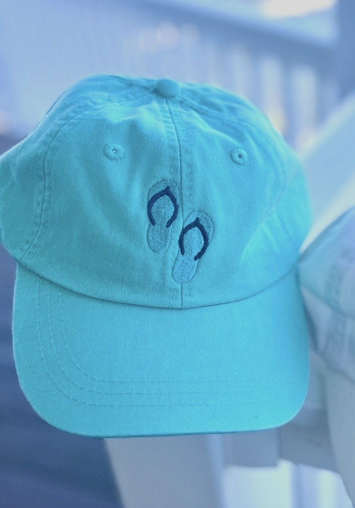 Teal ball cap with flip flops